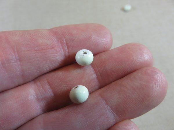 Perles en bois vert clair 7mm