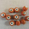 Perles céramique orange 10mm ronde
